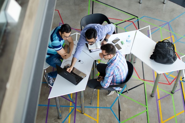 Image of employees working together.